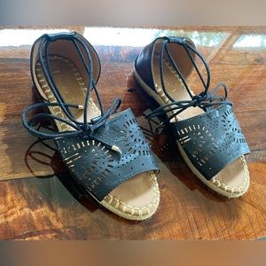 Yoki black and tan ankle tie sandals.